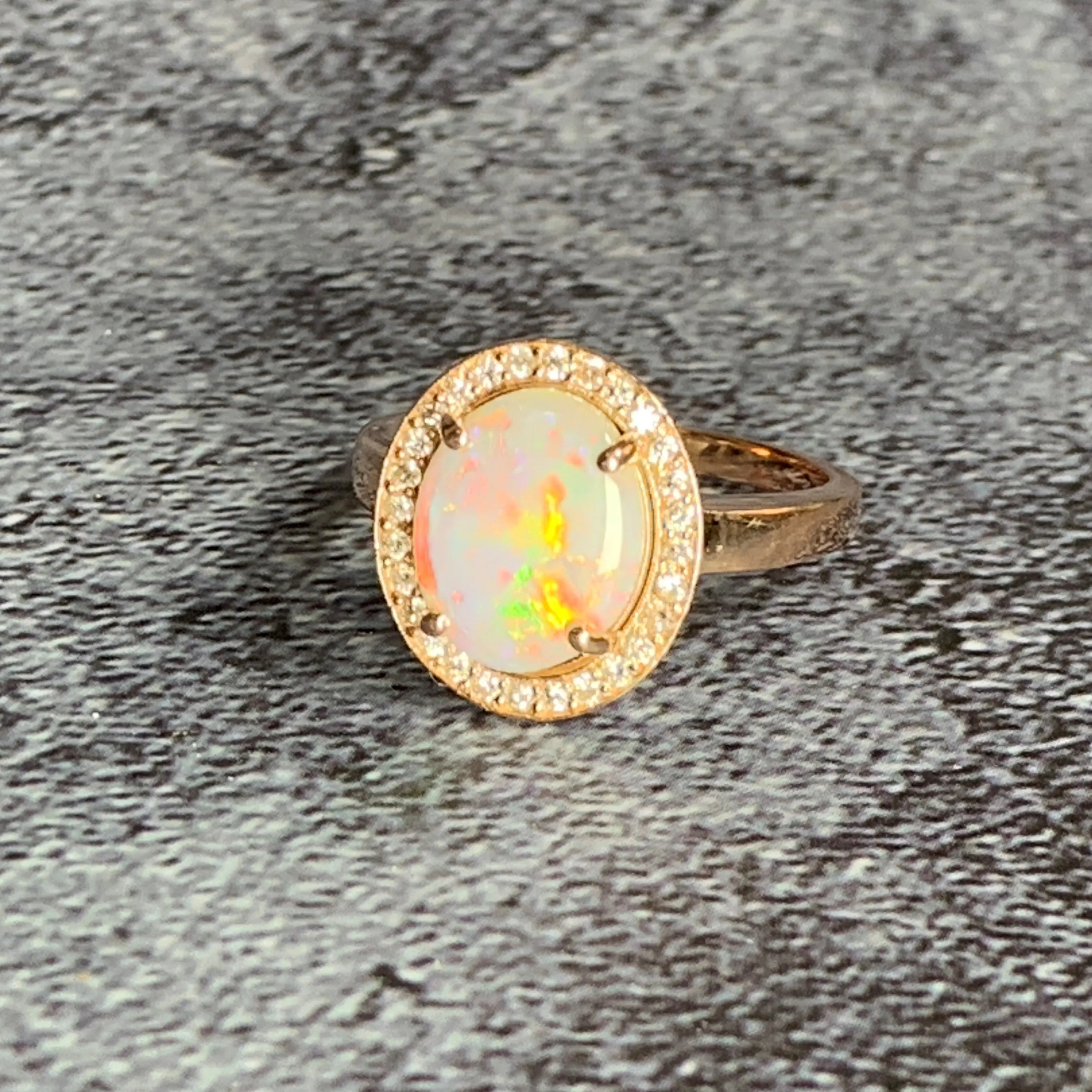 14kt Rose Gold Halo ring set with one 1.88ct White Opal and Diamonds