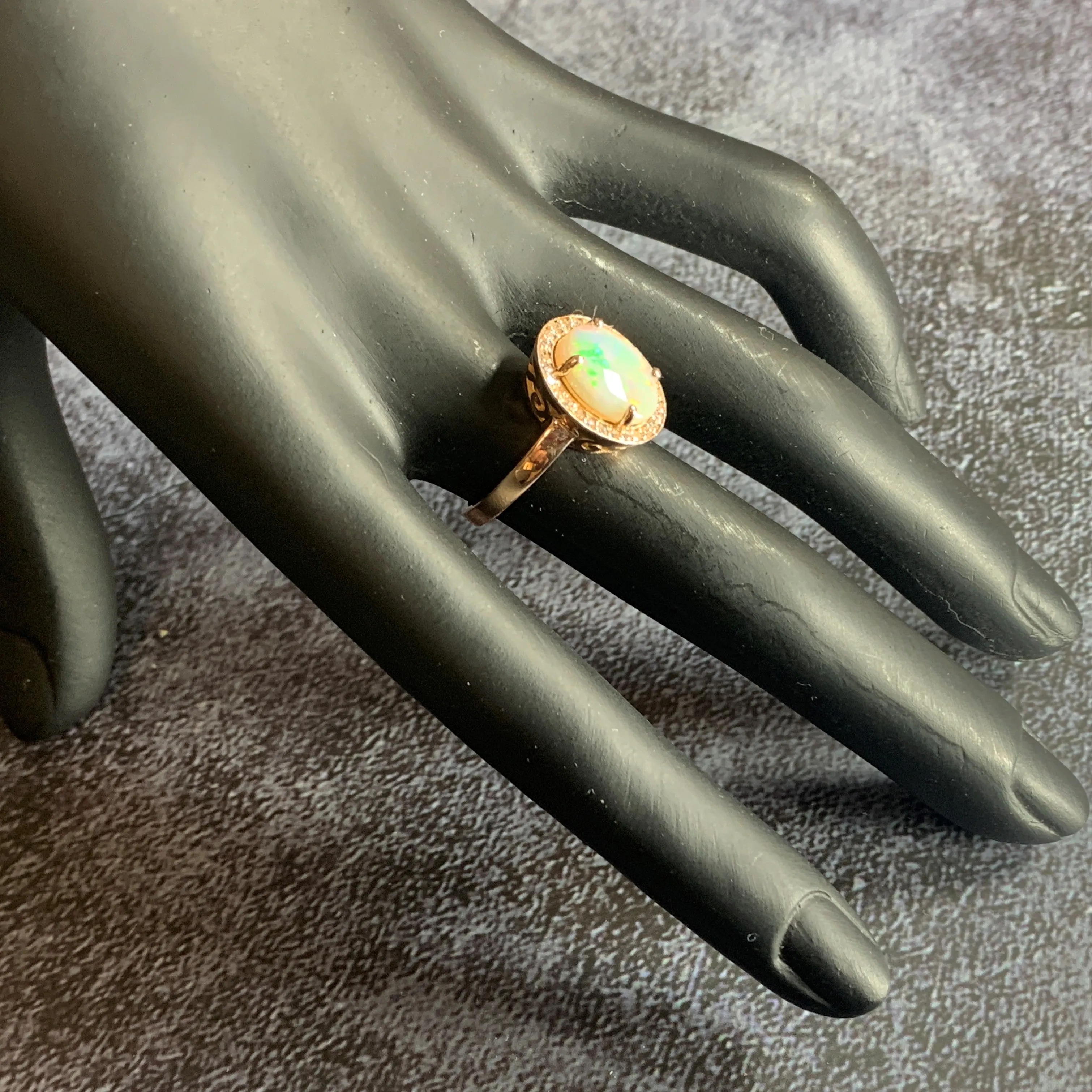 14kt Rose Gold Halo ring set with one 1.88ct White Opal and Diamonds