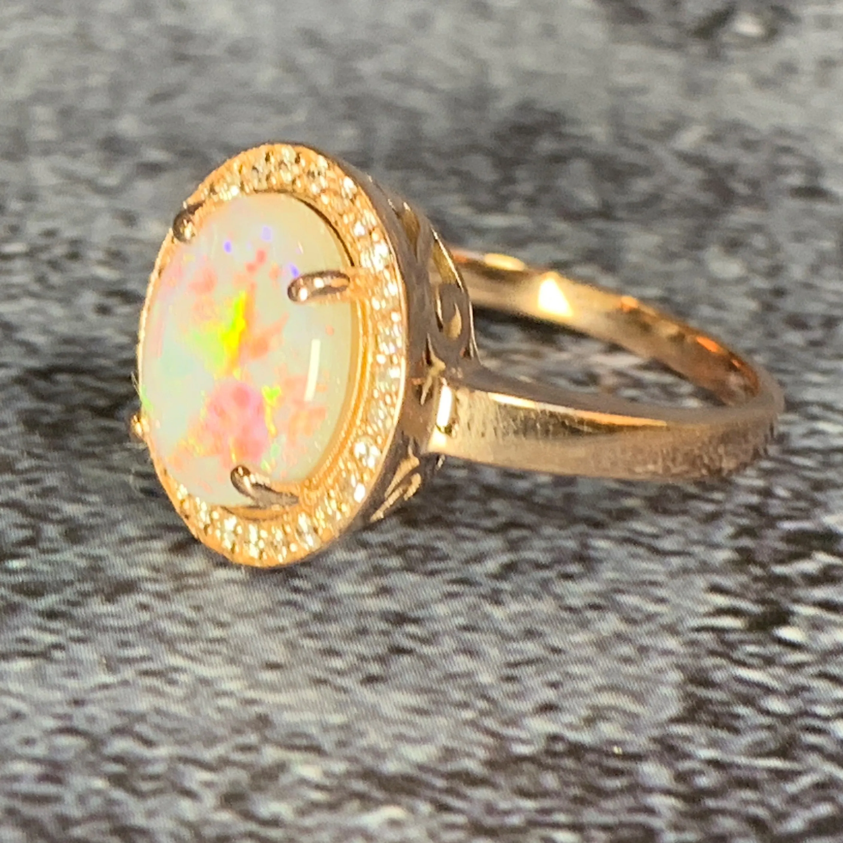 14kt Rose Gold Halo ring set with one 1.88ct White Opal and Diamonds