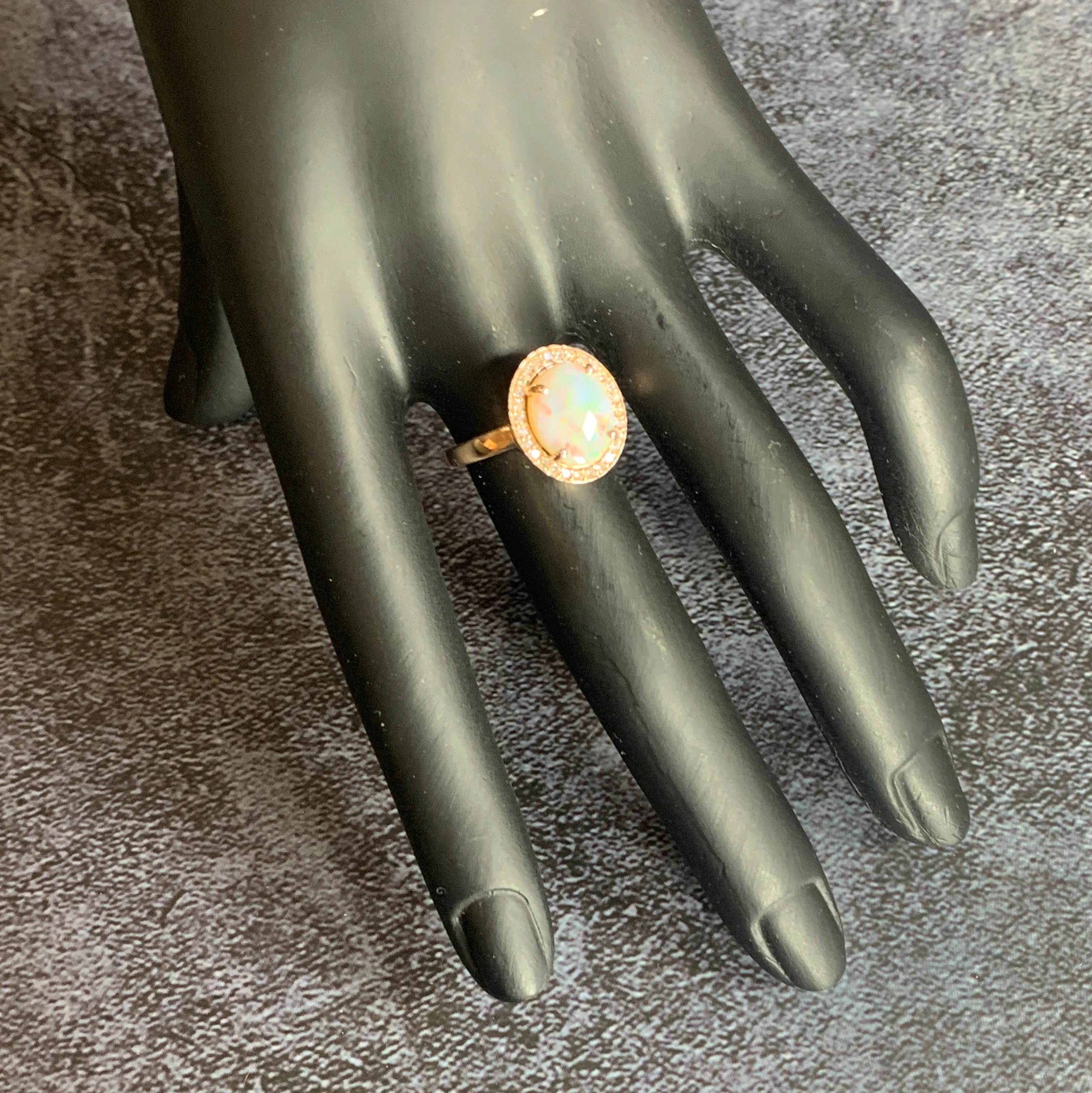 14kt Rose Gold Halo ring set with one 1.88ct White Opal and Diamonds
