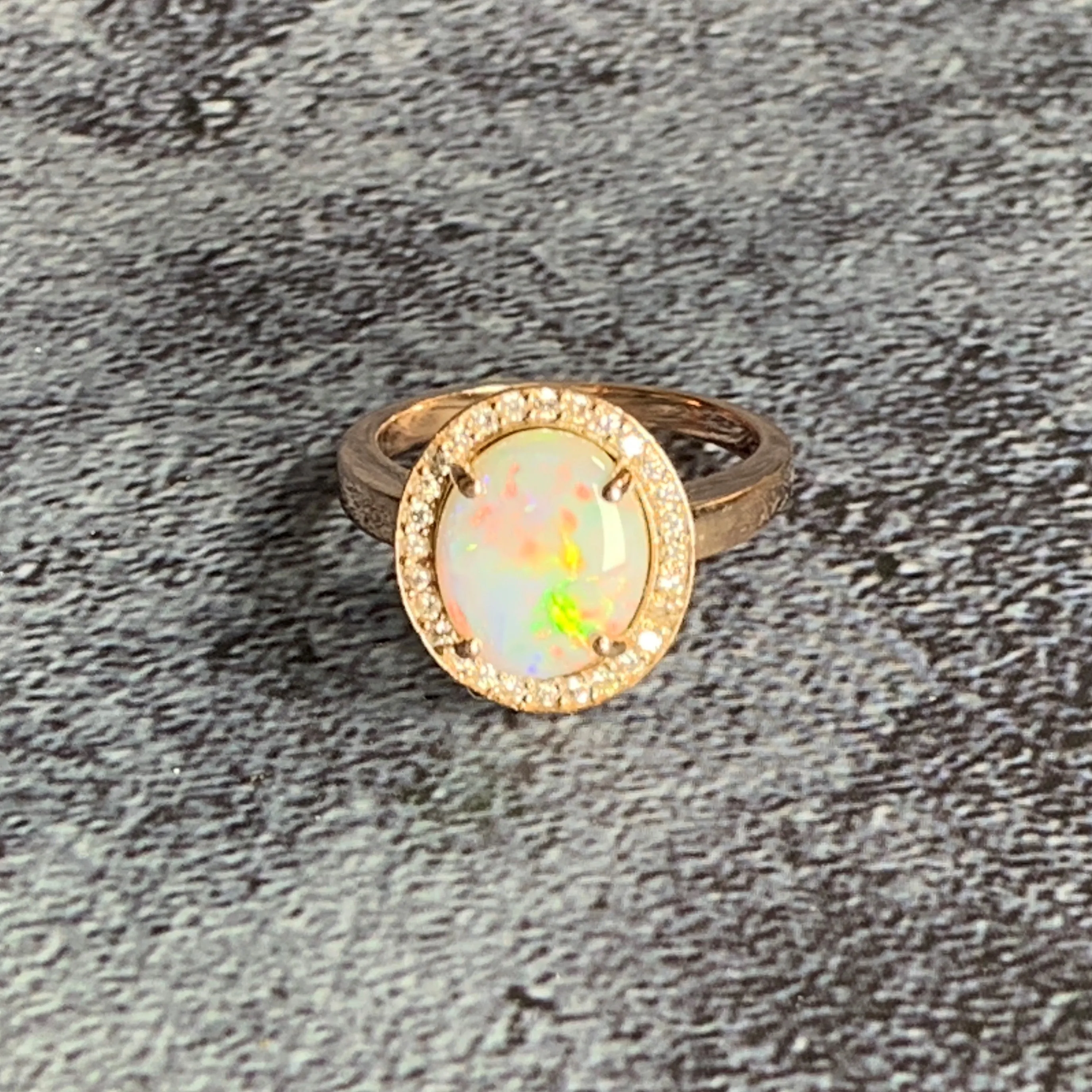 14kt Rose Gold Halo ring set with one 1.88ct White Opal and Diamonds