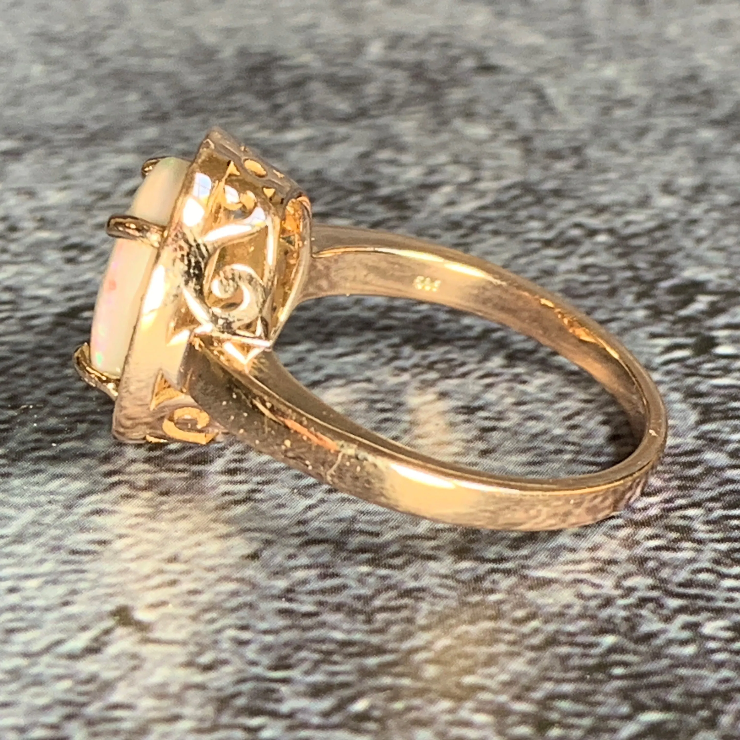 14kt Rose Gold Halo ring set with one 1.88ct White Opal and Diamonds