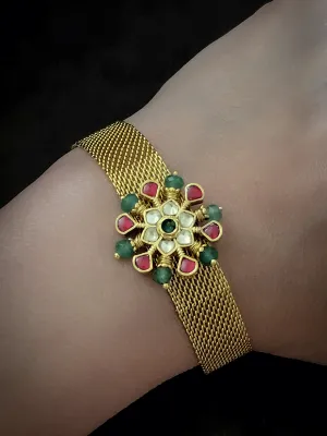 Paachi kundan flower with ruby and green bead detailing adjustable bracelet